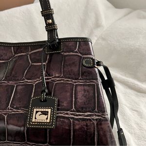 Dooney and Bourke Croco Purple Embossed Double Strapped Tassel Bag